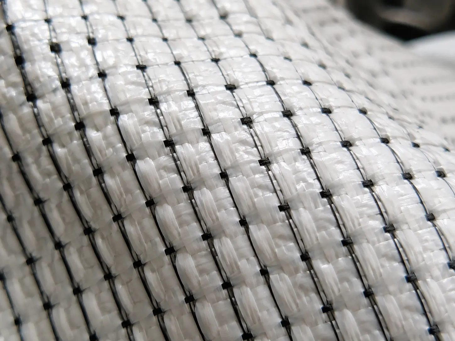 Close-up of interconnected conductive threads woven into Type C anti-static FIBC fabric