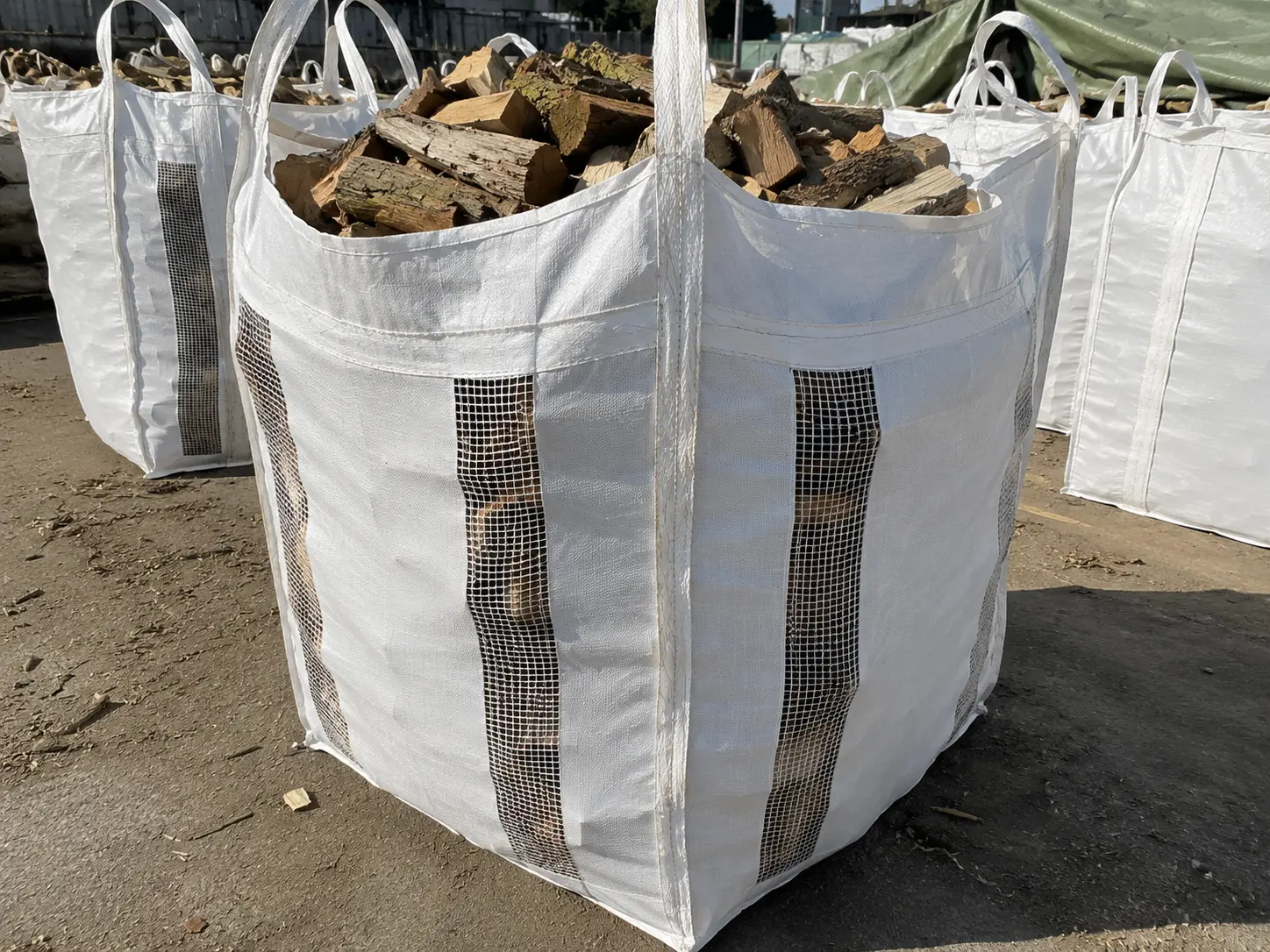 Ventilated FIBC bulk bag with open-weave fabric used for firewood and agricultural produce